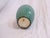 This Japanese vase has a crackled green glaze and is marked, made in Japan on the underside.