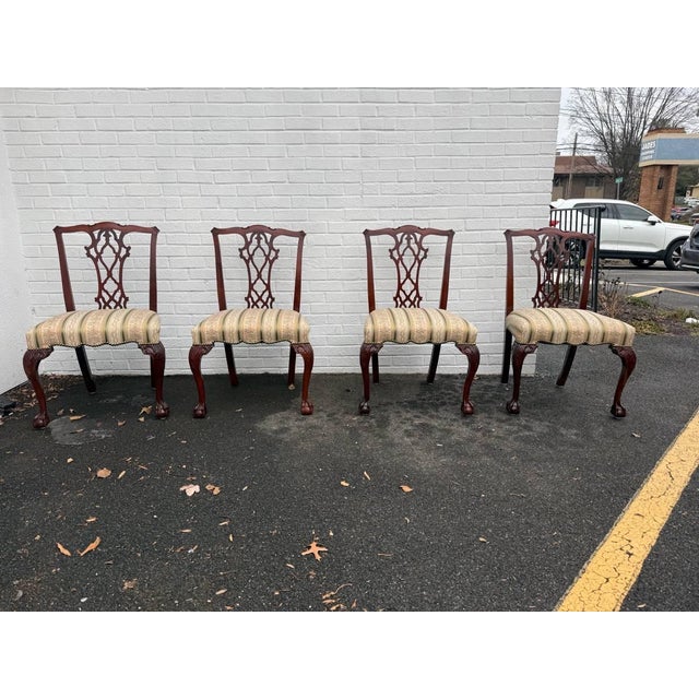 Early 20th century chippendale style brass nailed mahogany dining chairs. Set of 8, well carved ball and claw feet circa...