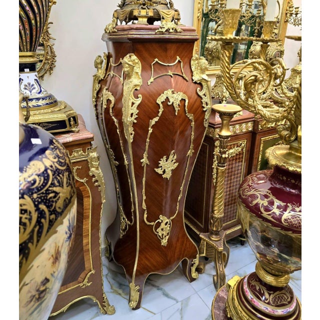 Magnificent French Rococo style pedestal column crafted from fine wood and richly adorned with ornate bronze accents and...