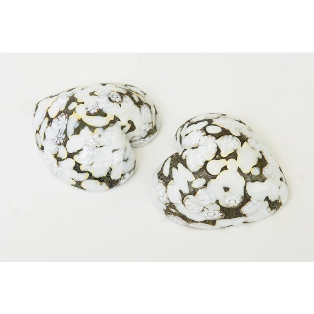 This pair of very special vintage Murano glass abstract paperweight heart sculptures are from their 50's and retain their...