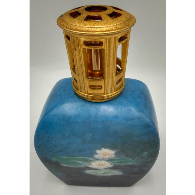 Elegant vintage porcelain fragrance lamp by Lampe Berger Paris and Goebel, decorated with imagery after celebrated French...