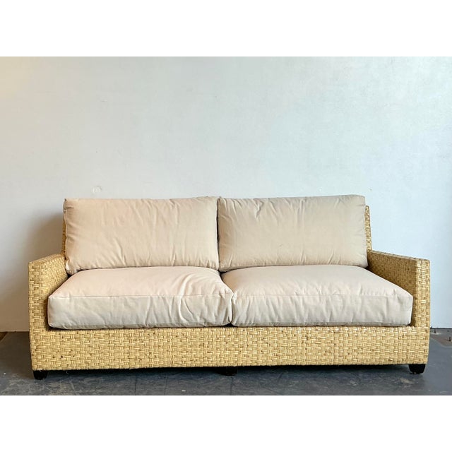 This exceptional vintage sofa, crafted in the iconic style of McGuire Furniture, perfectly embodies the breezy elegance of...