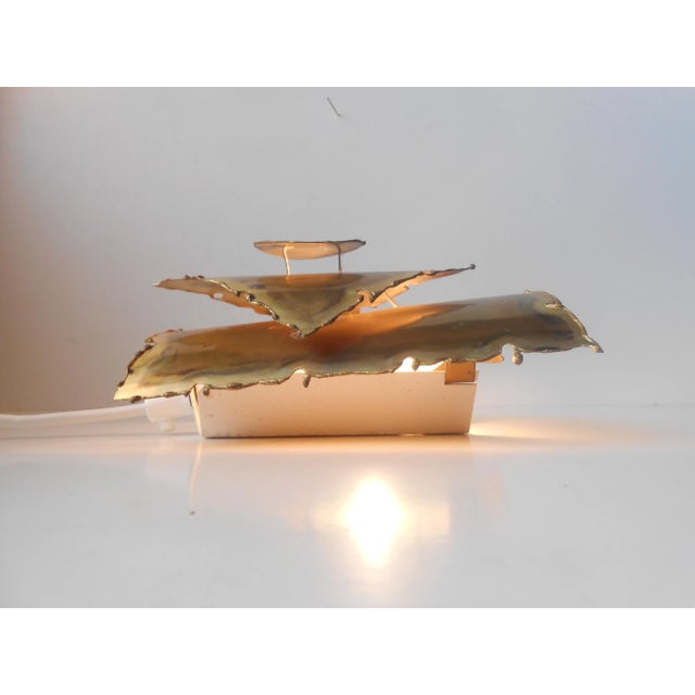 This sculptural wall light was produced by Holm-Sorensen in Denmark in the 1960s. The light is made from acid-etched...