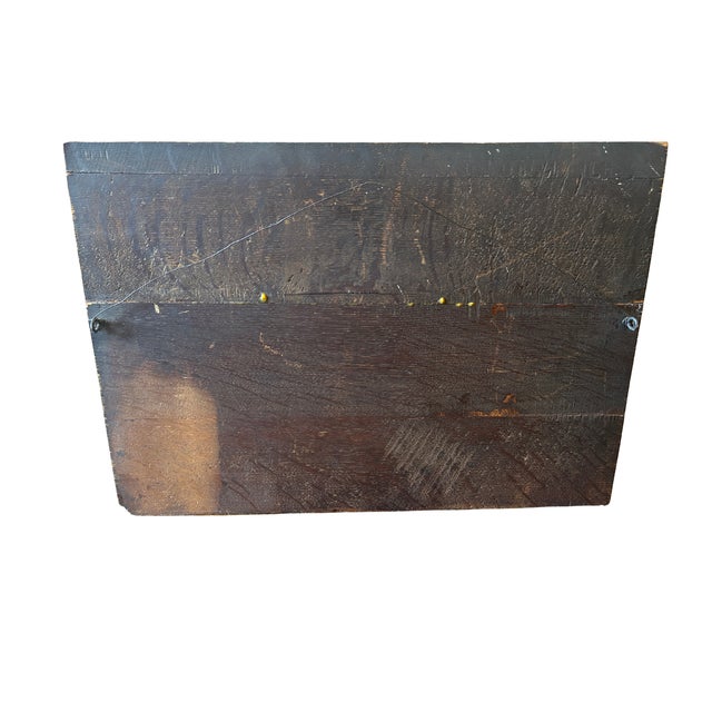 Wood carving of three well dressed men playing dice with a hanging bird. 21½" x 1" x 15"