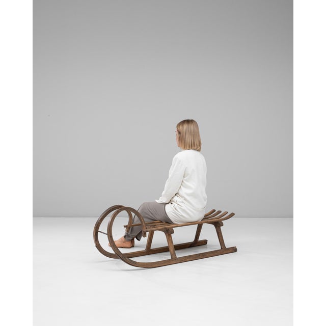 This 1900s Czech bentwood sled exemplifies early 20th-century craftsmanship with its elegantly curved frame and sturdy...