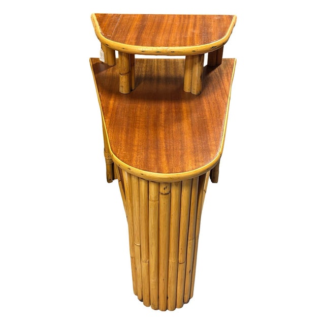This beautifully restored single restored rattan 2-tiered stacked rattan wedge table featuring 3 levels blends style and...
