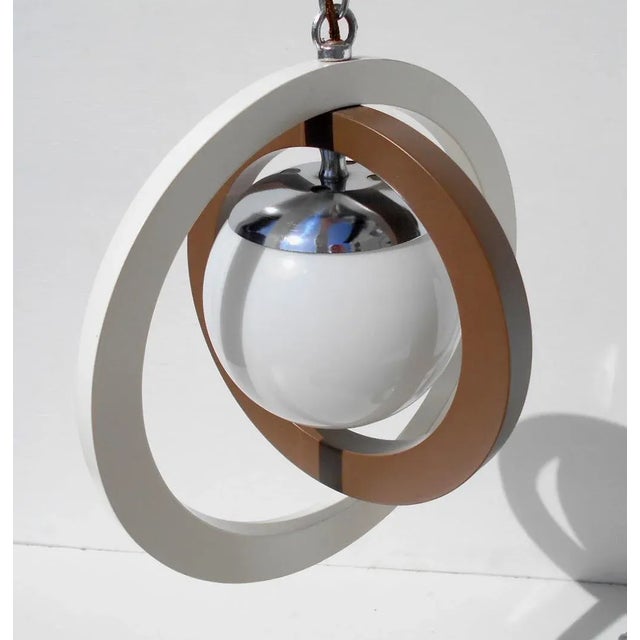- Space Age Italian pendant lamps from the 1960s - White and brown rings in painted wood - Shades in opal glass European...