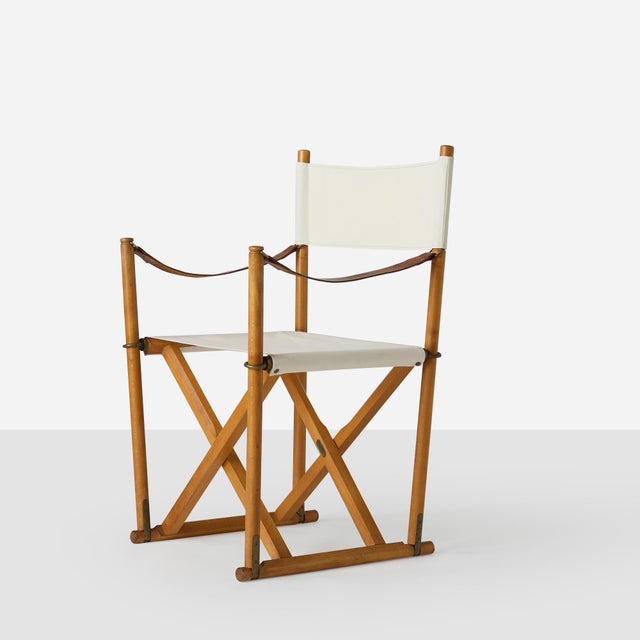 Description Pair of Folding Chairs by Mogens Koch Denmark, c1940s A pair of folding director’s-style chairs of beech,...