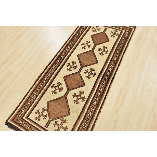 An authentic vintage tribal Qashqai runner hand-knotted with fine wool and natural dyes. This nomadic oriental rug...