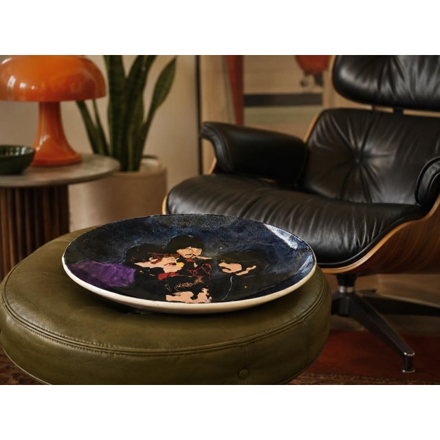 Large late 20th century hand-painted studio charger featuring a stylized portrait of The Beatles inspired by their Sgt....