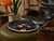 Large late 20th century hand-painted studio charger featuring a stylized portrait of The Beatles inspired by their Sgt....