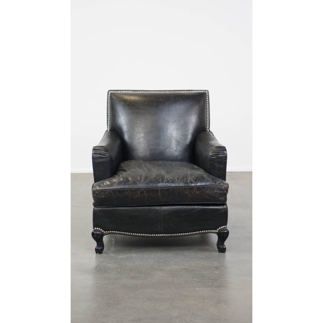 Offered is this luxurious black grained cowhide leather armchair/armchair with a deep seat and correct trim with...