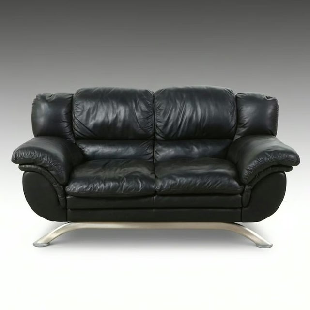 This contemporary Italian loveseat by Nicoletti S.p.A. pairs sleek European design with exceptional comfort. Designed by...