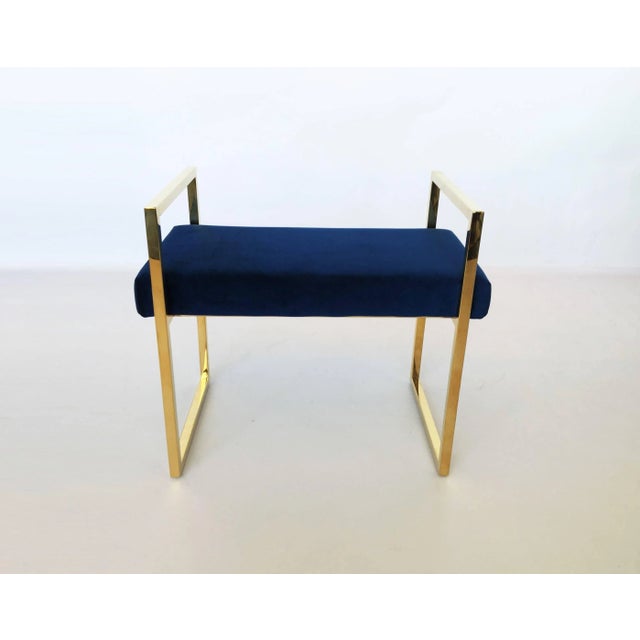 Pair of polished brass benches designed by Charles Hollis Jones in the 1970s. The frames of the benches are brass, they...