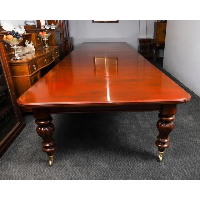 This is a monumental 19ft antique William IV solid mahogany dining table which can seat twenty and is also ideal for use...