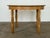 A solid oak round extending dining table by an anonymous Danish cabinetmaker, Denmark, 1970s. The table converts from...