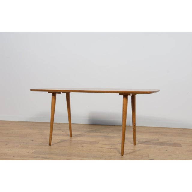 The coffee table was designed in the 1950s by Bohumil Landsman and Hubert Nepozitek. It was produced in the 1960s by the...