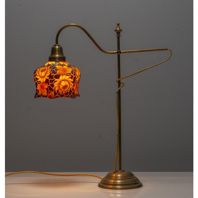 This chandelier dates to the 1920s and consists of a glass floral lampshade combined with a complete ceiling suspension...