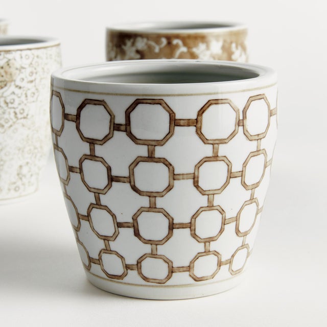 A classic chinoiserieinspired link pattern in taupe andWhite. In design, taupe is often associated with muted,...