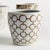 A classic chinoiserieinspired link pattern in taupe andWhite. In design, taupe is often associated with muted,...