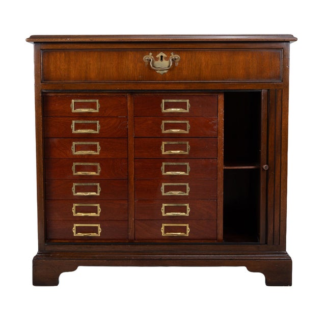 Here is a gorgeous and very unique piece from Kittinger. This filing cabinet features 14 drawers and two cubbies. It has...