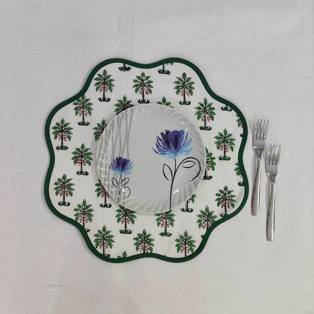 A beautiful set of round scalloped placemats in a fun palm print with a dark green piped edge. Pair this placemat with the...