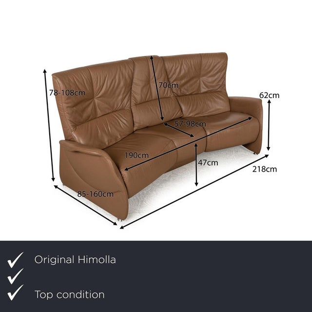 The Trapez sofa from Himolla is covered in beige leather and stands on floor-to-ceiling side panels. The three-seater...