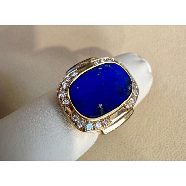 Introducing our exquisite Estate Lapis Lazuli Ring, crafted in 14 Karat Yellow Gold. This stunning ring features a...