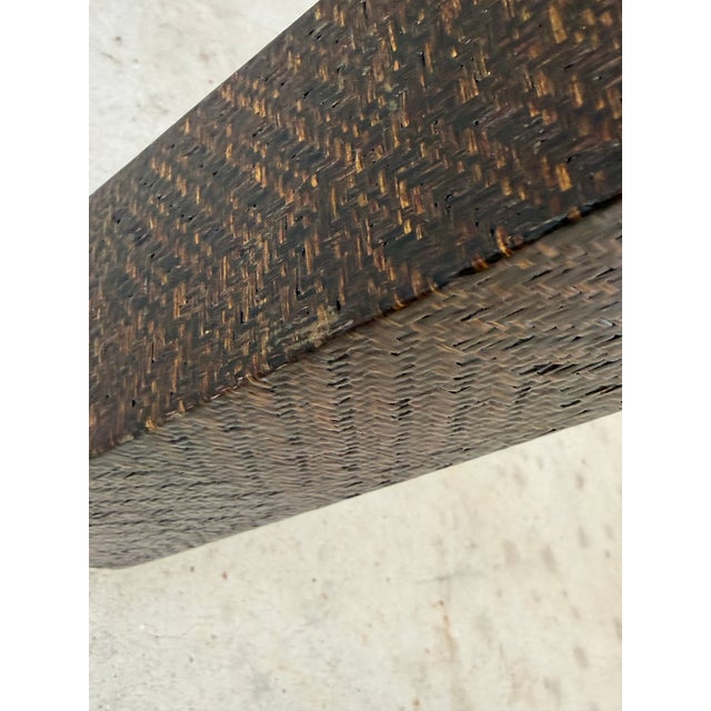 A stunning vintage console table by Harrison Van Horn featuring his signature woven grasscloth raffia finish in a rich,...