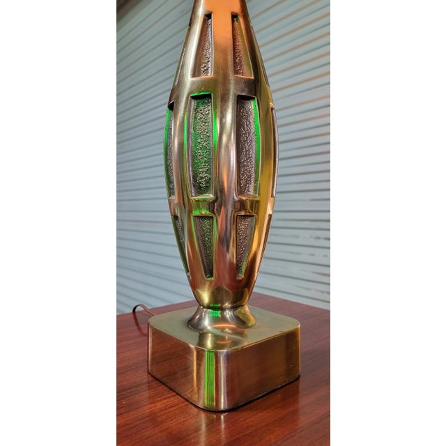 Solid brass table lamp designed by Tony Paul for Westwood Lighting. Bowling pin or bottle form with textured rectangular...