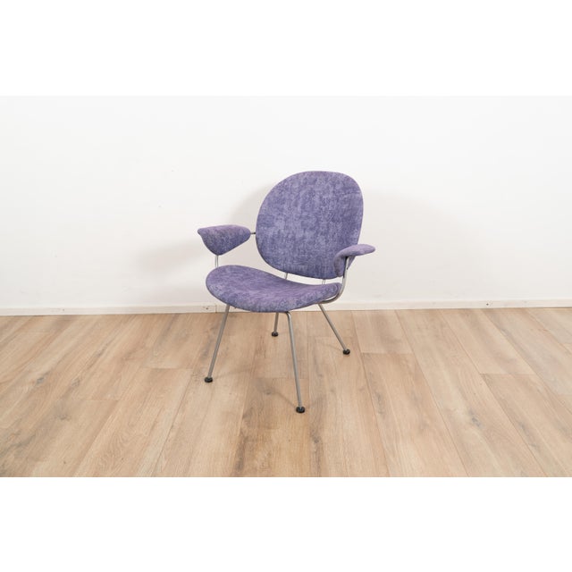 Model 302 Lounge chair by W.H. Gispen for Kembo. The chair is upholstered with a purple white patterned fabric on a grey...