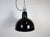 Industrial black enamel pendant light made in former Czechoslovakia during the 1950s. White enamel inside the shade. Cast...