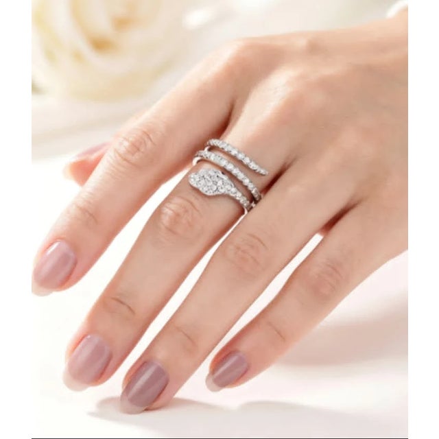 Material: 14K White Gold Stones: Brilliant Round Diamonds - 1 carat total Accent Stones: 2 Natural Emeralds (Snake Eyes)...