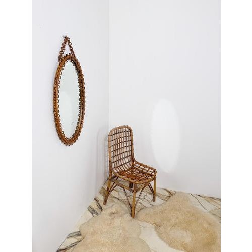 Refined Mid-Century Modern oval mirror that beautifully embodies the distinctive style of the Mediterranean Riviera....