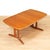 Sleek and very stylish, this 1970s Danish modern extending dining table was manufactured by AM Møbler (Ansager Møbler) of...