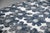A graphic composition rendered in crisp navy against a clean ground, this 30-inch performance pillow brings a fresh,...