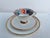 Dessert Place setting made of pure white porcelain with a gold rim all around. A wonderful relief of diamonds and dotted...