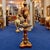 Make a magnificent statement with this exceptional decorative ensemble, featuring an elegant burgundy porcelain vase...