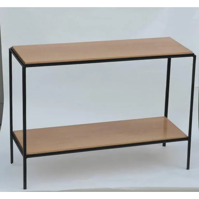 Pair of chic wrought iron and oak 'Rectiligne' end tables by design Frères. Elegant, slender design. Second shelf is 6...