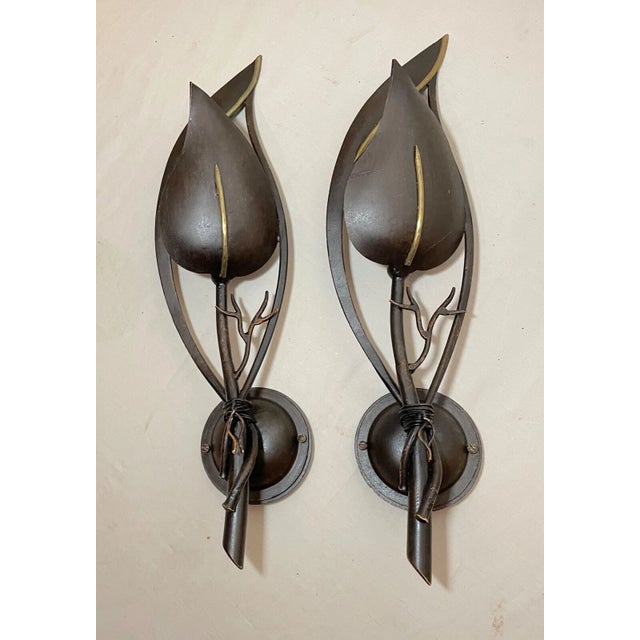 Add a touch of elegance to your home decor with this pair of handmade Italian bronze patinated cast iron wall sconces....