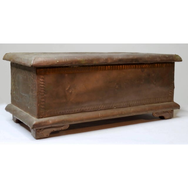 This cheerywood box is covered in a pressed copper with animal figures and foliate detailing. When open the box shows its...