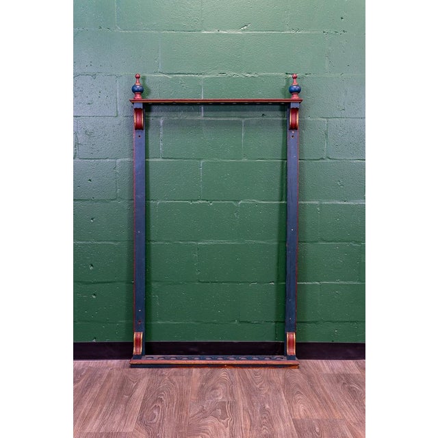 Peak Americana! Retaining its original red, blue, and gold paint! This Gilded Age pool/billiards cue rack is beautifully...