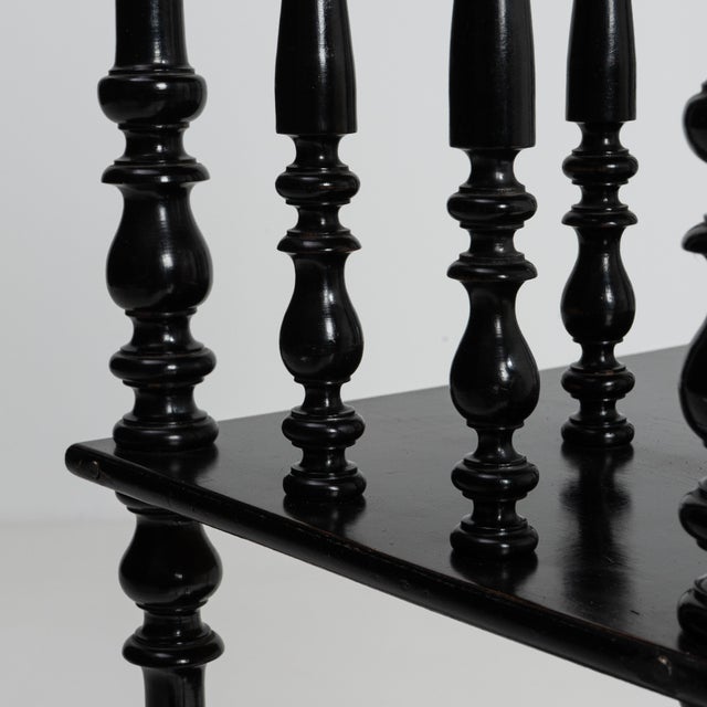 A Napoleon III etagere featuring layered shelving and dark finish. The piece has a compact footprint with vertical...