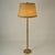 Elegant floor lamp in light brown leather with large parchment & leather shade creating a warm light. The hand made drum...