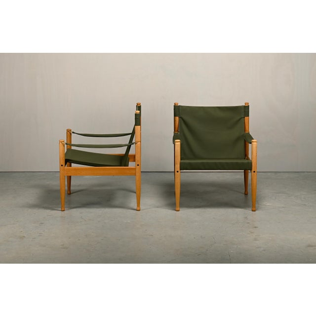 Set of two safari lounge chairs designed by Erik Wørts for Niels Eilersen, Denmark, 1970s. The frames are crafted from...