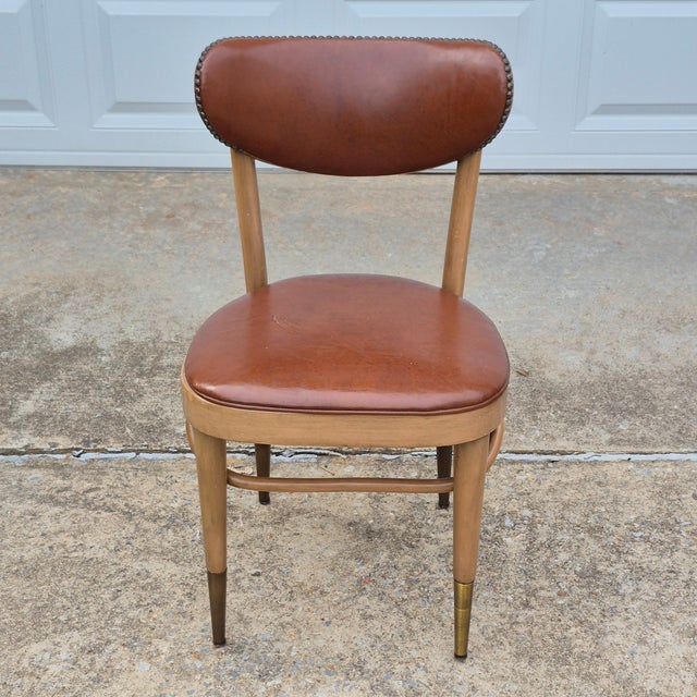 This is a fun little chair by American furniture maker Chairmasters with a solid walnut frame, padded back and seat...