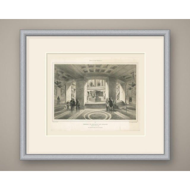 A tinted lithograph of the tomb of napoleon in the crypt beneath the dome of les invalides in paris. The viewer looks...