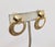 1980s goldtone smooth top with textured hoop clip earrings. Marked "GIVENCHY©" on the back of the hoops. Measure: 1 1/4...