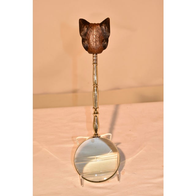 19th century magnifying glass with a hand turned brass and hand-carved Yorkie handle from England. This is a charming...