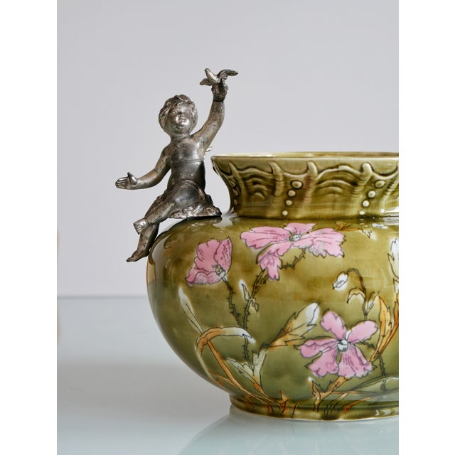 Beautiful one of a kind art nouveau jardiniere with hand painted flower decor and cherubine figures. Amazing condition,...